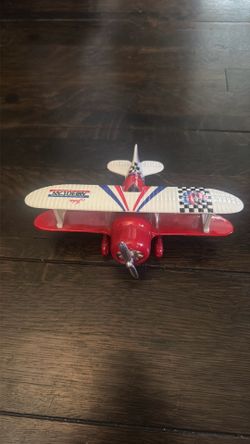 Small hand held plane moving propeller and rubber wheels