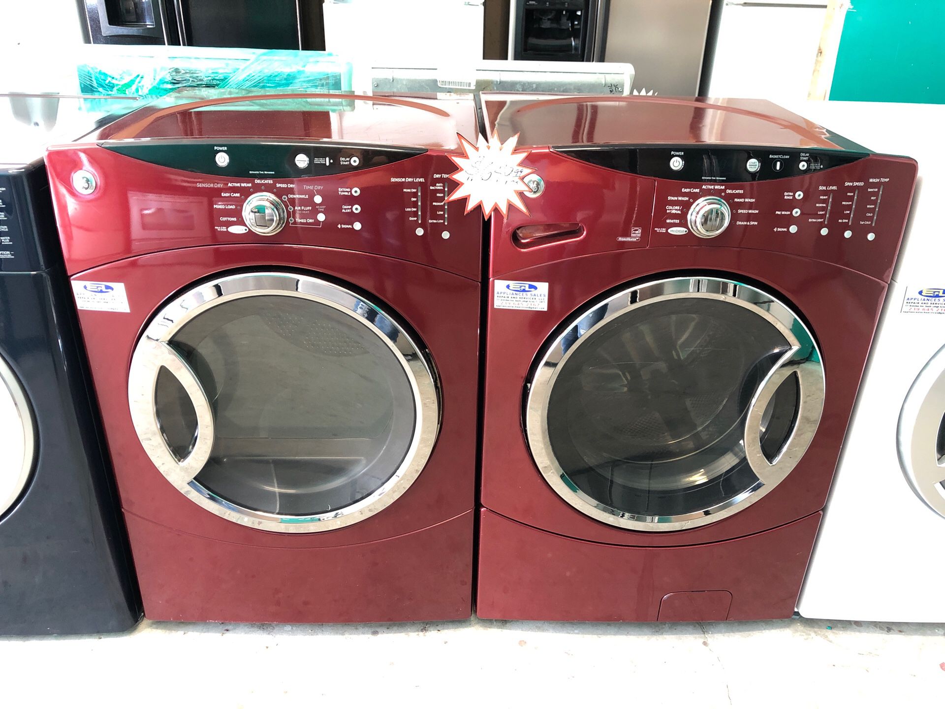 A set of red front load washer and dryer