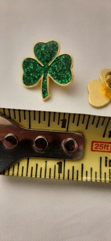 Sparkling green glitter look shamrock pin.