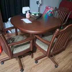 Kitchen Table And 3 Rolling Chairs