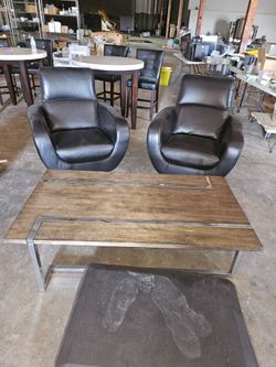 Leather chairs with table