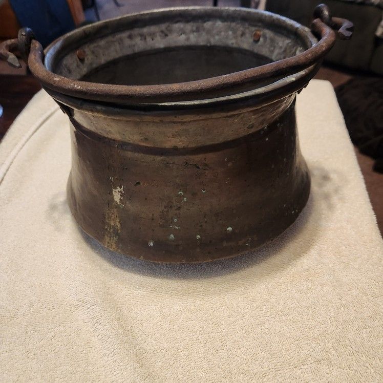 Antique copper pot, possibly a cauldron featuring a wrought iron handle ...pit itself is 7" high and 9.5," in diameter...buy it for $45.00