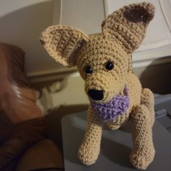 Hand crocheted chihuahua with safety eyes and a purple bandanna. 