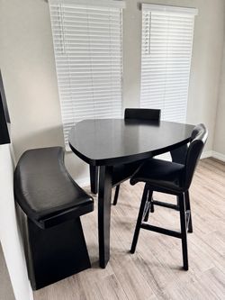 NEED GONE ASAP- High top dining table with bench and 2 swivel chairs !