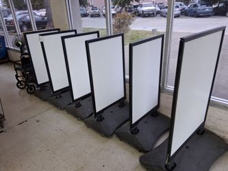 Portable signage with water ballasts and Heavy duty springs