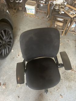 used Steelcase Leap V2 Ergonomic Office Chair in black fabric. It features LiveBack technology that changes shape to support the spine, adjustable sea