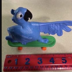 CA. 2011. RIO. BLUE MACAW BIRD WITH SKATE BOARD. McDONALDS