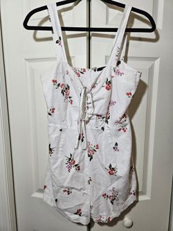 Forever twenty one size large, white romper, with flowers