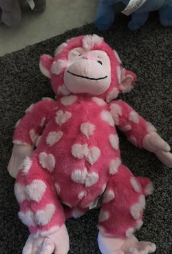 Stuffed Monkey with hearts all over it.