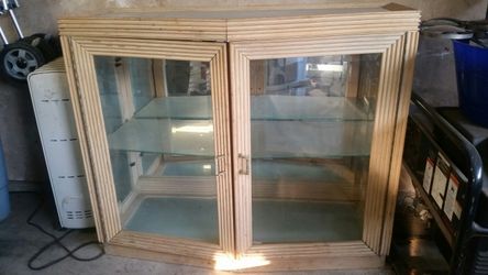 Glass cabinet with mirror and light