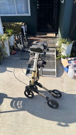 Standing walker with seat