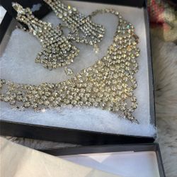 The Necklace Goes Into A Little Bit Of A Choker Look At The Bracelet. It's The Yellow Rhinestones, The Different Ones That Shine Different rent Colors