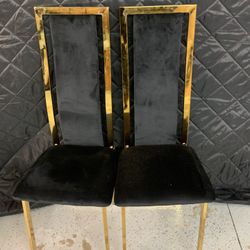 2 Black And Gold Chairs 