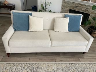 White couch with pillows