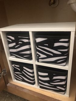 Small storage shelf with boxes