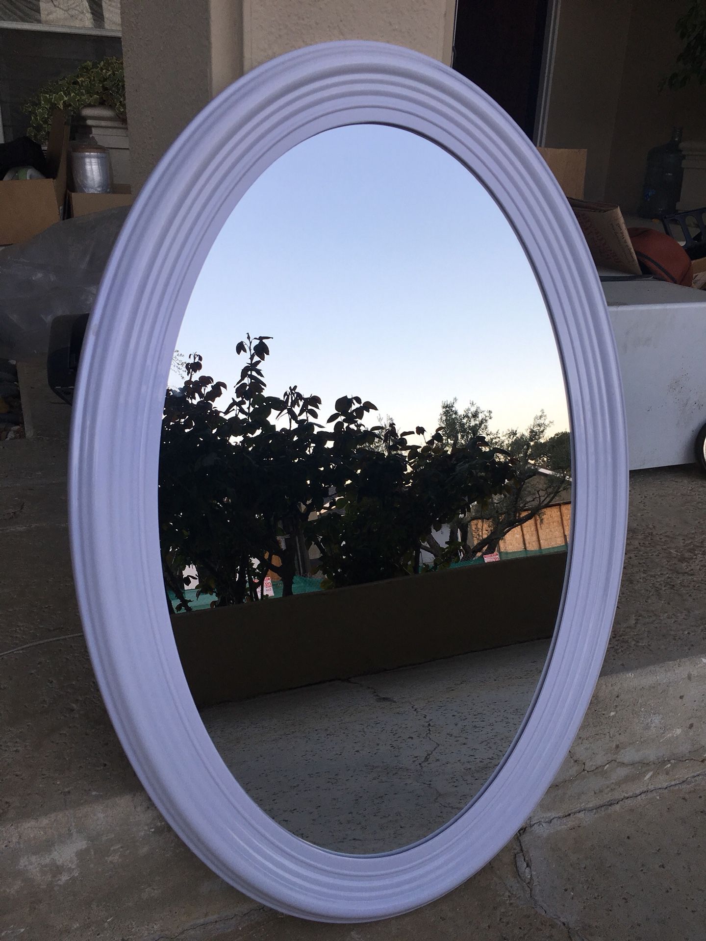 Oval mirror 22x30 inch in a white frame. New