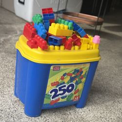 Mega Bloks building set with storage bin and lid.