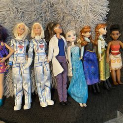 4 Barbies And 4 Disney Dolls 