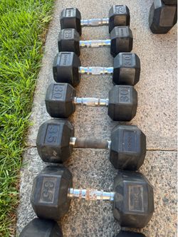 Mismatched dumbbell weights by ROGUE and ETE . PRICES LISTED AT THE BOTTOM UNDER DESCRIPTION 👇👇👇