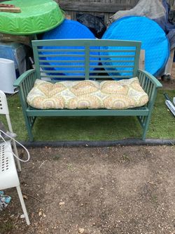 Patio or outdoor wood bench with pillow