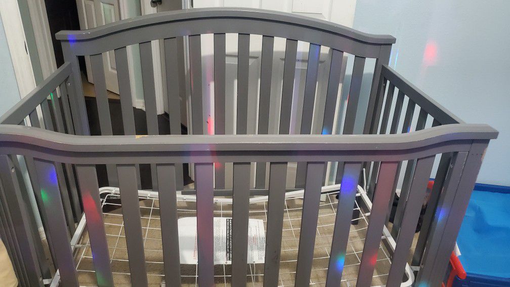Free Gray Baby Crib without mattress in Good Condition