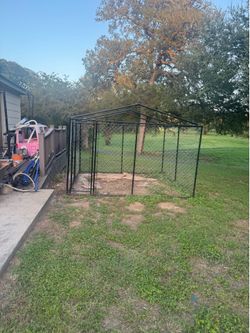 Kennel with roof and door entrance.