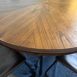 Wooden And Metal Table And Four Leather Chairs