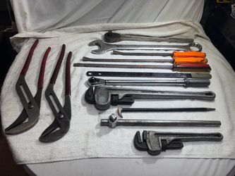 13 Large Heavy Duty tools.  Wrenches, pry bars, pipe wrench