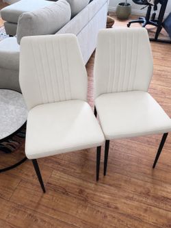 Pair of white dinning chairs