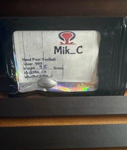 hand-poured .999 fine silver football collectible/art