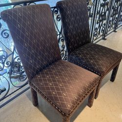 Pair Of upholstered tall-back dining chairs