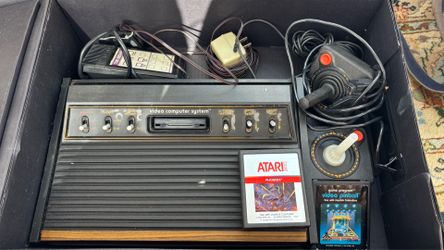 Vintage Atari console, controllers & two games