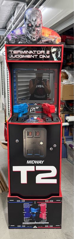 Original Terminator 2 1up arcade with riser and back lit topper