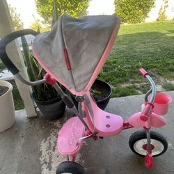 AI Overview    +3 The item pictured is a pink Radio Flyer 4-in-1 Stroll 'N Trike.  