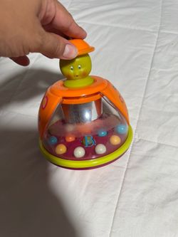 B. Toys Baby Spinning Top Toy