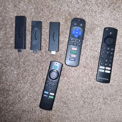 Firesticks And A Insignia Remote And A Roku Remote 