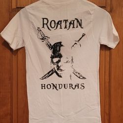 Roatan Honduras t-shirt featuring a pirate-themed graphic. Kids Size? 14"wide 