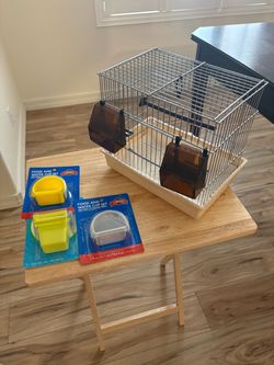 Small bird cage with dishes