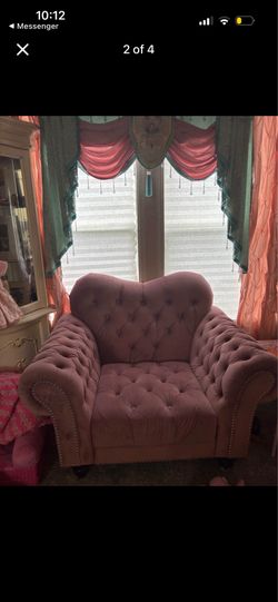 Pink couch with chair and pillows