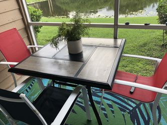 Outdoor table with 4 chairs + Rug