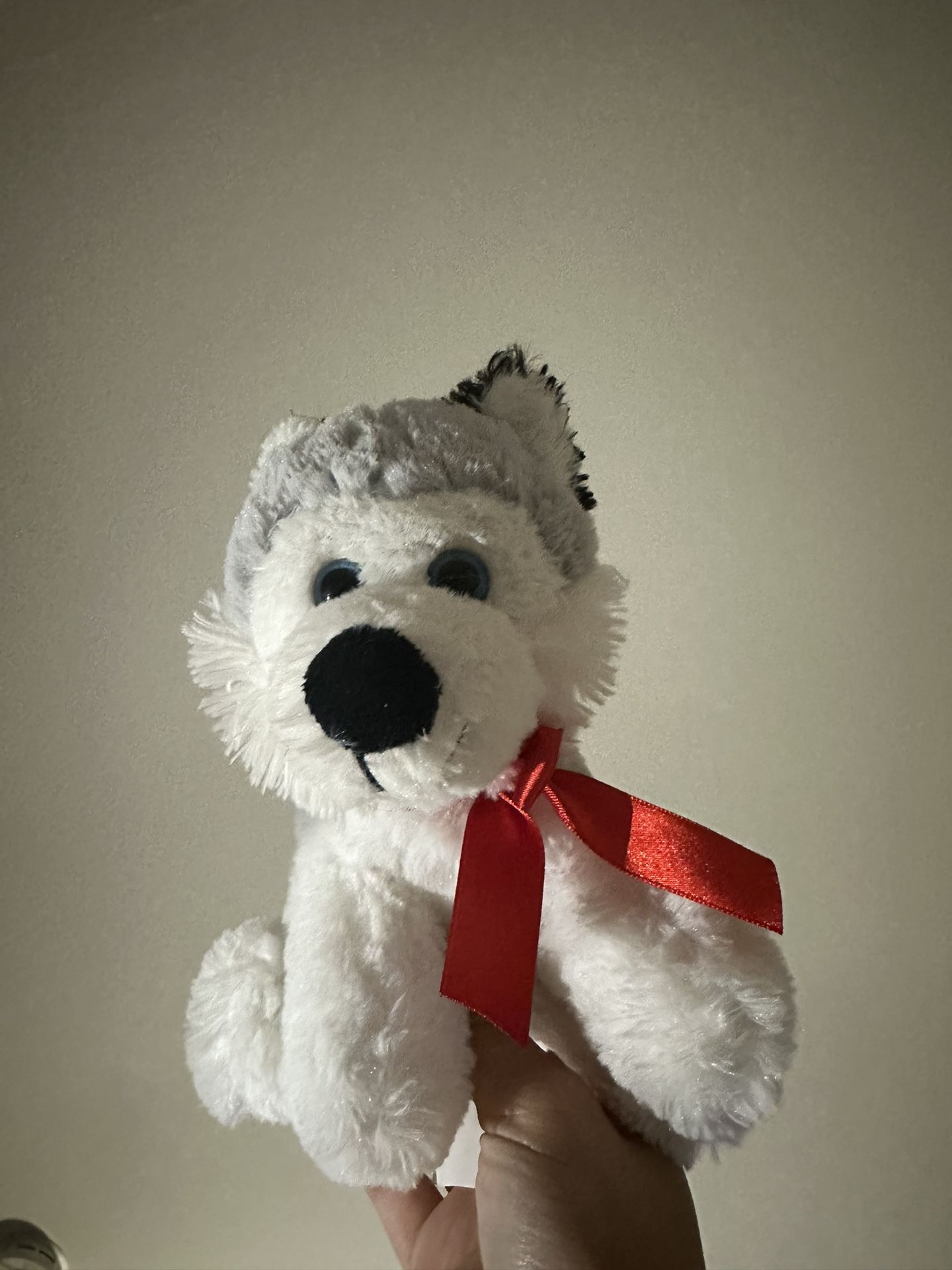 Husky Stuffed Animal With A Red Bow