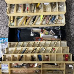 Loaded tackle boxes and fishing gear 