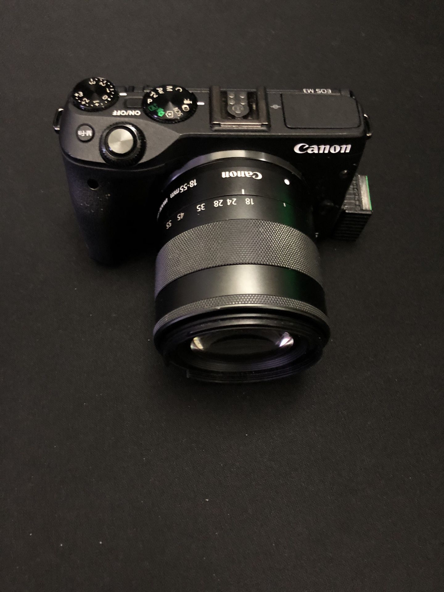 Canon eos m3 with 18-55mm lens and battery. USED