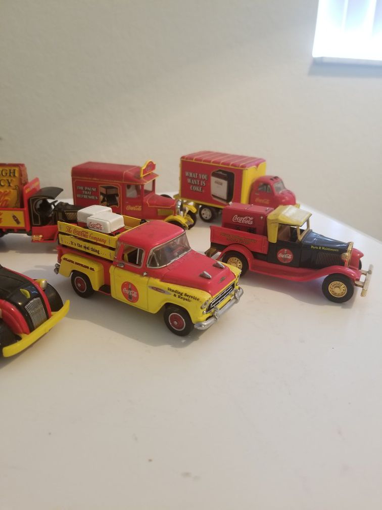 Collection of Coca Cola toy cars with can