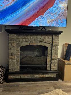 Electric Fireplace with Faux Stone Mantel