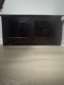 Mahogany Brown Entertainment TV Stand Or Storage Cabinet Swivel Wheels Can Hold A Large Tv Up To 60 Inches Or More Smoke Glass Top & Door From Raymor
