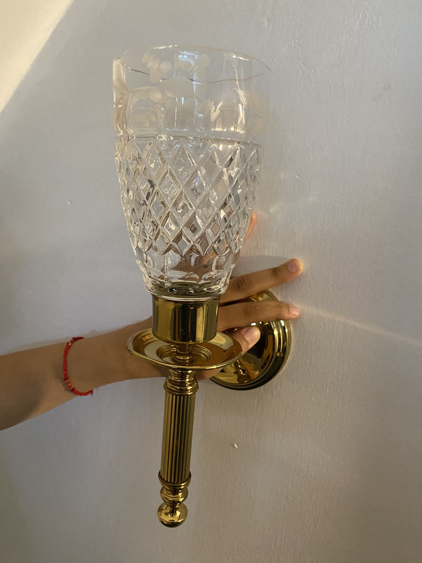 Wall held candle holder