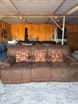 Design by Ashley Brown Faux Leather Upholstery Reclining Sofa