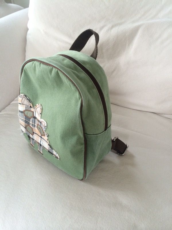 Pottery Barn kids green backpack with a dinosaur