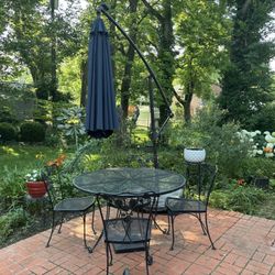 Wrought iron table and four chairs $150